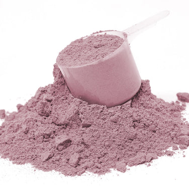 A scoop full of pink powder sitting on top of a mound of G.I. Benefits® powder